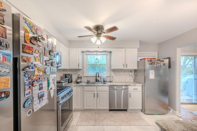 8106 W 89th Pl, Hickory Hills, IL 60457 - kitchen with appliances with stainless steel finishes, a sink, ceiling fan, white cabinets, and backsplash