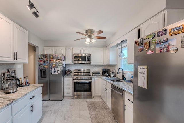8106 W 89th Pl, Hickory Hills, IL 60457 - kitchen featuring appliances with stainless steel finishes, a ceiling fan, a sink, and white cabinets