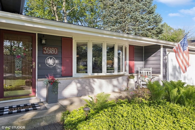 3S180 Cypress Dr, Glen Ellyn, IL 60137 - view of exterior entry with a porch