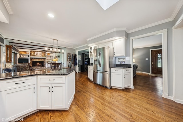 3S180 Cypress Dr, Glen Ellyn, IL 60137 - kitchen with stainless steel refrigerator with ice dispenser, light wood-style floors, white cabinetry, crown molding, and dark stone counters
