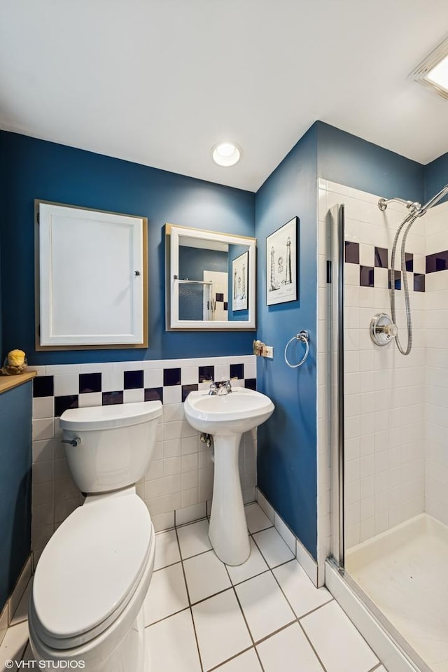 3S180 Cypress Dr, Glen Ellyn, IL 60137 - bathroom with a stall shower, toilet, tile patterned flooring, and a wainscoted wall