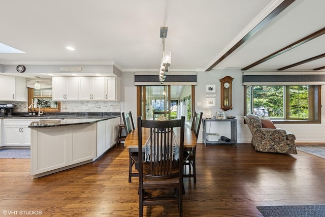 3S180 Cypress Dr, Glen Ellyn, IL 60137 - dining space with dark wood finished floors, crown molding, and a skylight