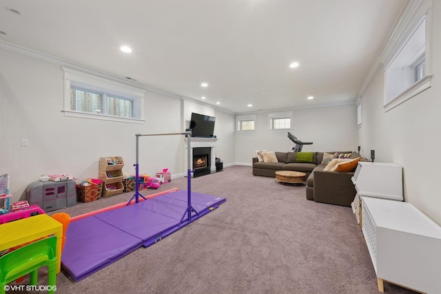 1959 W Berwyn Ave, Chicago, IL 60640 - playroom with ornamental molding, carpet, a fireplace with flush hearth, and recessed lighting