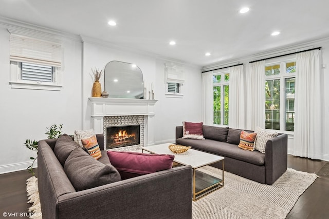 1959 W Berwyn Ave, Chicago, IL 60640 - living room featuring recessed lighting, crown molding, a tiled fireplace, and dark wood-style flooring