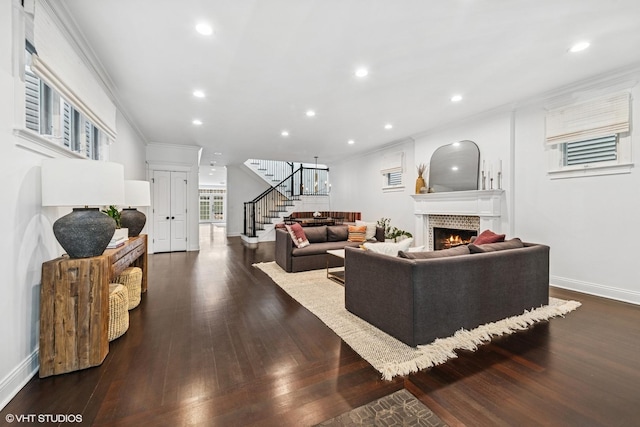 1959 W Berwyn Ave, Chicago, IL 60640 - living area featuring stairs, a warm lit fireplace, dark wood finished floors, ornamental molding, and recessed lighting