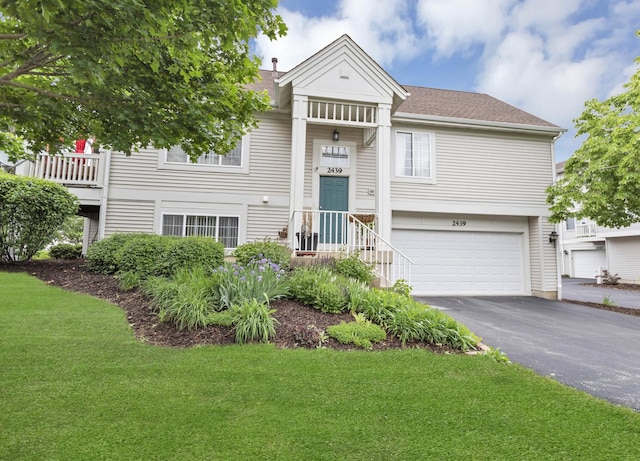 2439 Daybreak Ct Unit 2439, Elgin, IL 60123 - view of front of house featuring a front yard, asphalt driveway, and an attached garage