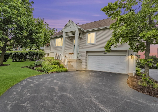 2439 Daybreak Ct Unit 2439, Elgin, IL 60123 - view of front of property featuring asphalt driveway, an attached garage, a front yard, and a shingled roof