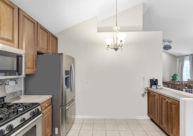 2439 Daybreak Ct Unit 2439, Elgin, IL 60123 - kitchen with appliances with stainless steel finishes, a chandelier, lofted ceiling, brown cabinets, and light countertops