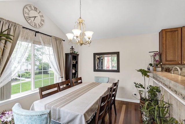 2439 Daybreak Ct Unit 2439, Elgin, IL 60123 - dining area with a chandelier, healthy amount of natural light, dark wood-style flooring, vaulted ceiling, and baseboards
