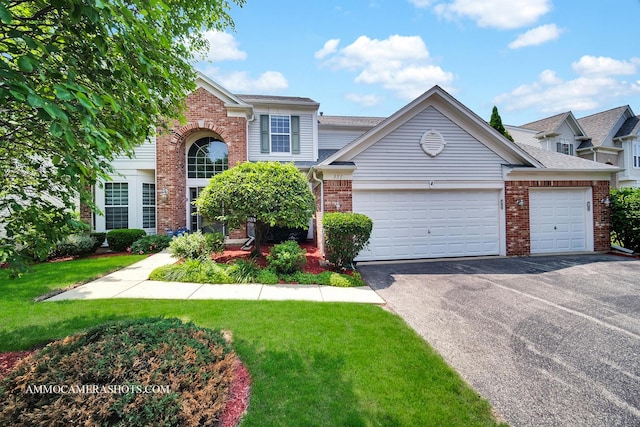 351 Tiger St, Bolingbrook, IL 60490 - view of front of house featuring brick siding, driveway, a garage, a front yard, and a shingled roof