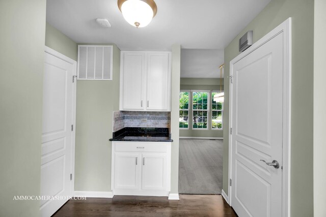 351 Tiger St, Bolingbrook, IL 60490 - kitchen with dark wood-style floors, white cabinetry, baseboards, backsplash, and dark stone countertops