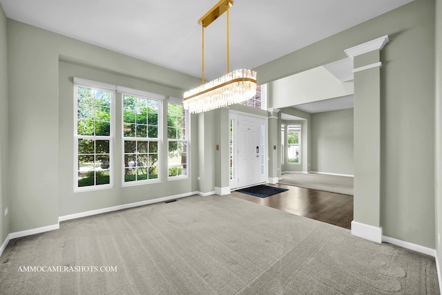 351 Tiger St, Bolingbrook, IL 60490 - carpeted entryway featuring baseboards and a chandelier