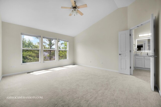 351 Tiger St, Bolingbrook, IL 60490 - unfurnished bedroom with light carpet, baseboards, high vaulted ceiling, ensuite bath, and a ceiling fan