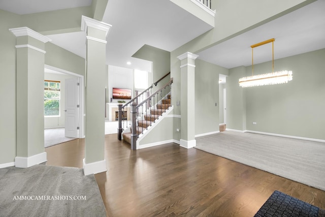 351 Tiger St, Bolingbrook, IL 60490 - foyer entrance with ornate columns, stairs, wood finished floors, and baseboards