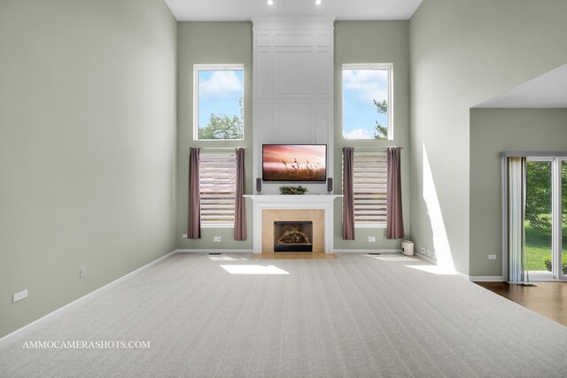351 Tiger St, Bolingbrook, IL 60490 - unfurnished living room with carpet, a tile fireplace, and baseboards