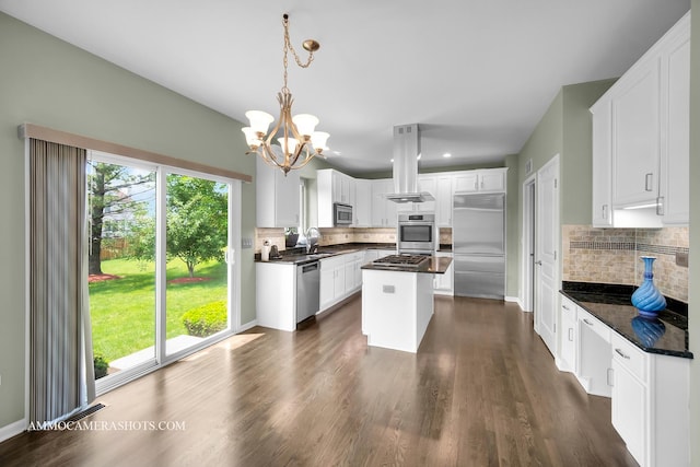 351 Tiger St, Bolingbrook, IL 60490 - kitchen featuring stainless steel appliances, island exhaust hood, dark countertops, and decorative backsplash