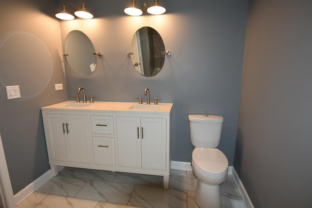 full bath featuring marble finish floors and double vanity