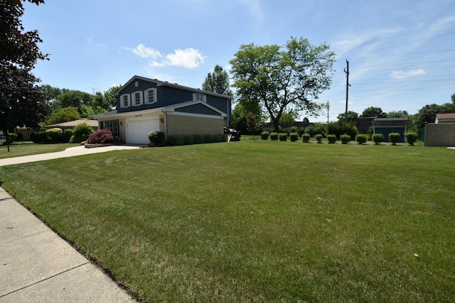 view of home's exterior featuring an attached garage, driveway, and a yard