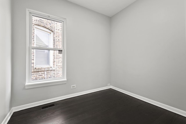5123 W 23rd Pl, Cicero, IL 60804 - spare room with baseboards and dark wood-style flooring