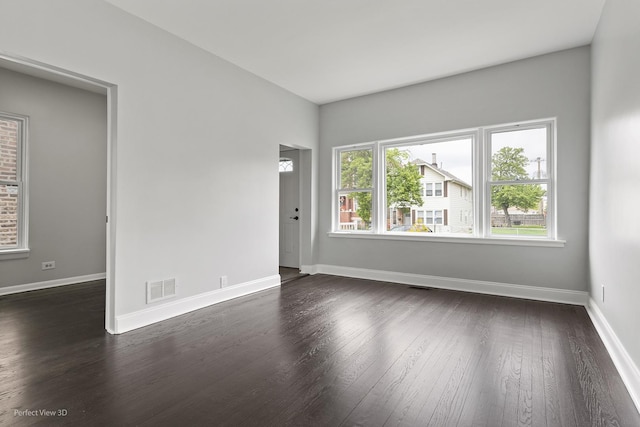 5123 W 23rd Pl, Cicero, IL 60804 - empty room with dark wood-type flooring and baseboards