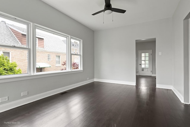 5123 W 23rd Pl, Cicero, IL 60804 - empty room with dark wood finished floors, ceiling fan, and baseboards