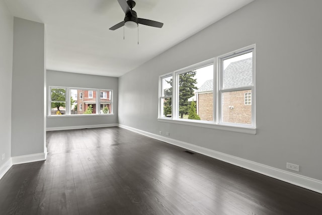 5123 W 23rd Pl, Cicero, IL 60804 - unfurnished room with baseboards, dark wood finished floors, and a ceiling fan
