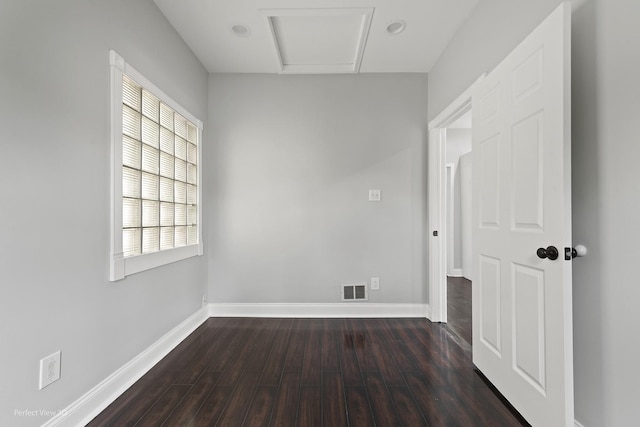 5123 W 23rd Pl, Cicero, IL 60804 - spare room with dark wood-type flooring, baseboards, and attic access