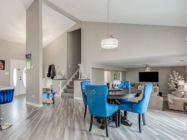 1811 Cumberland Dr, Plainfield, IL 60586 - dining area with stairway, wood finished floors, baseboards, high vaulted ceiling, and a ceiling fan