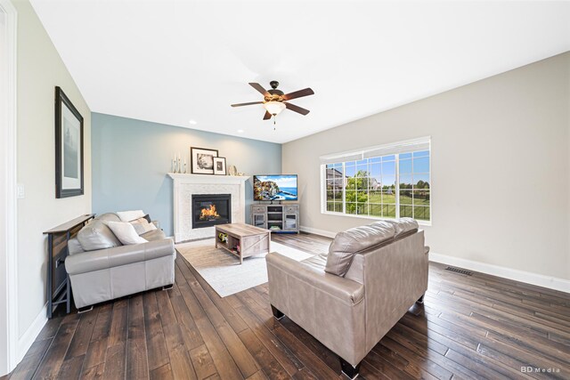 8500 Dungarvan Rd, Frankfort, IL 60423 - living room with baseboards, dark wood-style flooring, ceiling fan, a glass covered fireplace, and recessed lighting