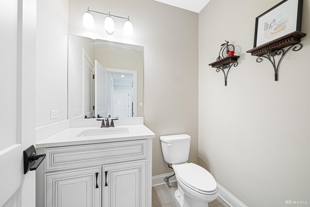 8500 Dungarvan Rd, Frankfort, IL 60423 - bathroom featuring toilet, vanity, and baseboards