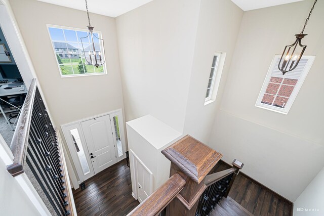 8500 Dungarvan Rd, Frankfort, IL 60423 - staircase featuring a chandelier, wood finished floors, and a towering ceiling