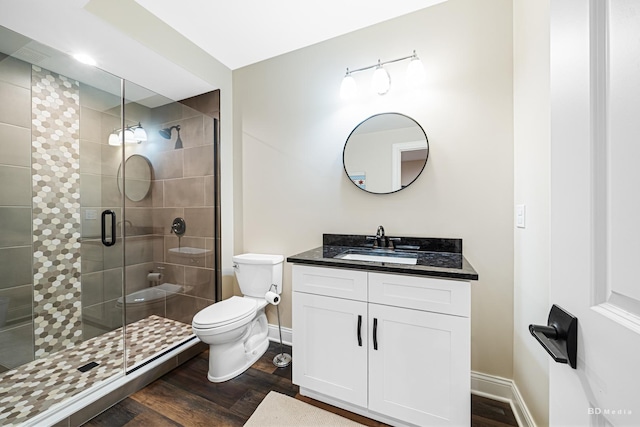 8500 Dungarvan Rd, Frankfort, IL 60423 - bathroom featuring wood finished floors, vanity, toilet, and a stall shower