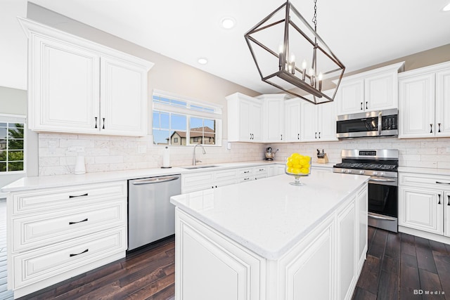 8500 Dungarvan Rd, Frankfort, IL 60423 - kitchen featuring stainless steel appliances, a sink, dark wood-style floors, a center island, and recessed lighting