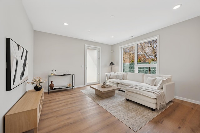944 Beloit Ave Unit 3, Forest Park, IL 60130 - living room with light wood-style flooring, baseboards, and recessed lighting