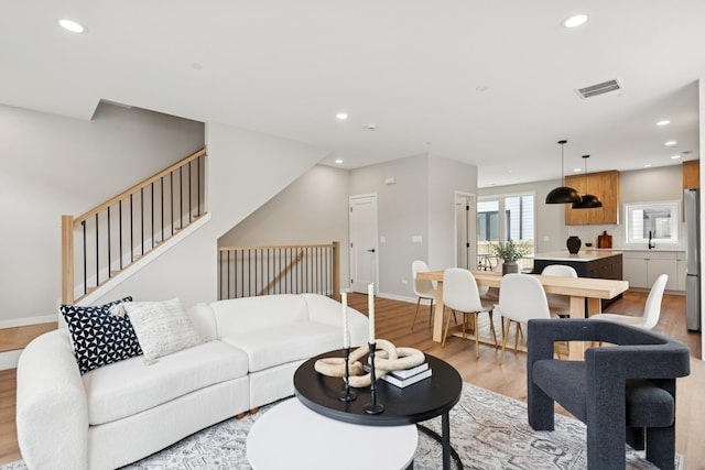 944 Beloit Ave Unit 3, Forest Park, IL 60130 - living area featuring light wood-style flooring, recessed lighting, stairway, and baseboards