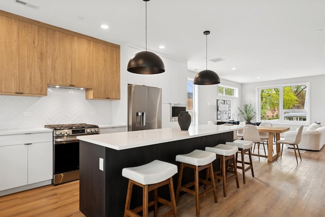 944 Beloit Ave Unit 3, Forest Park, IL 60130 - kitchen with appliances with stainless steel finishes, modern cabinets, a center island, light countertops, and recessed lighting