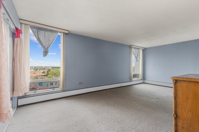 8815 W Golf Rd Unit 7A, Niles, IL 60714 - carpeted empty room featuring a baseboard heating unit and a textured ceiling