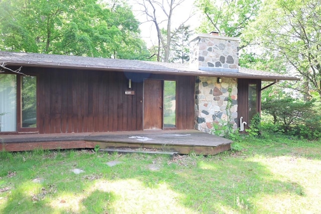N2335 Main Rd, Lake Geneva, WI 53147 - back of house with a chimney and a lawn