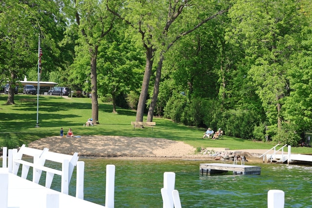 N2335 Main Rd, Lake Geneva, WI 53147 - dock area featuring a water view and a lawn