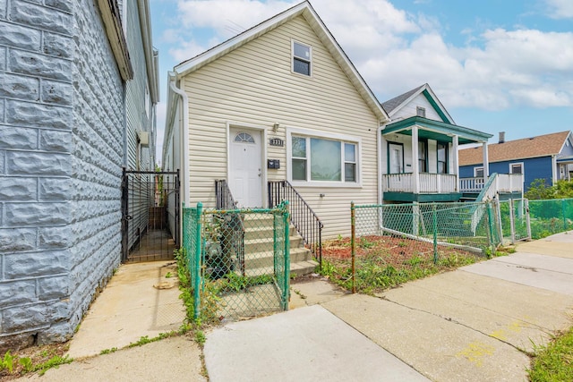 3331 S Ashland Ave, Chicago, IL 60608 - shotgun-style home featuring a gate and a fenced front yard