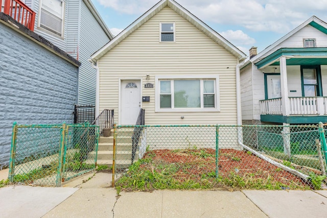 3331 S Ashland Ave, Chicago, IL 60608 - view of front of house featuring a fenced front yard and a gate
