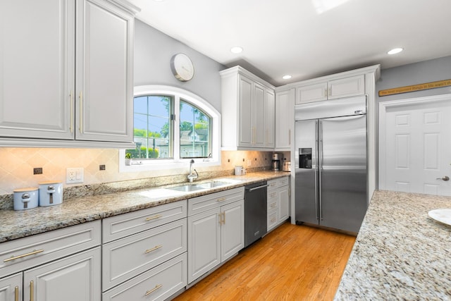 6972 W Imlay St, Chicago, IL 60631 - kitchen with stainless steel appliances, tasteful backsplash, white cabinets, light wood-type flooring, and recessed lighting
