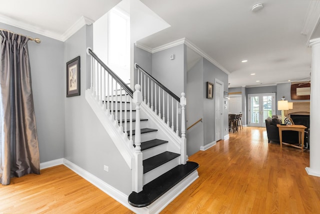 6972 W Imlay St, Chicago, IL 60631 - stairs featuring wood finished floors, ornamental molding, recessed lighting, and a fireplace