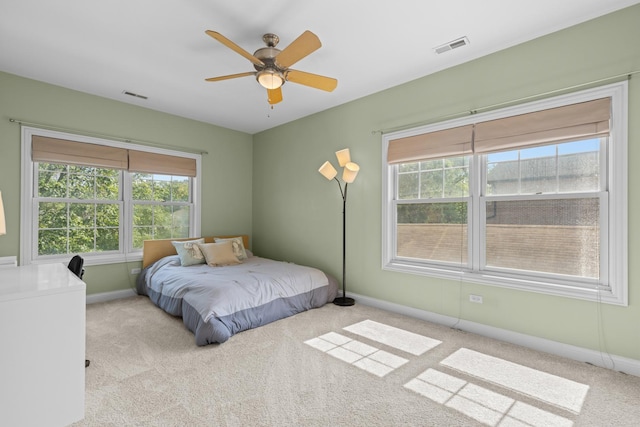 6972 W Imlay St, Chicago, IL 60631 - carpeted bedroom featuring multiple windows and ceiling fan
