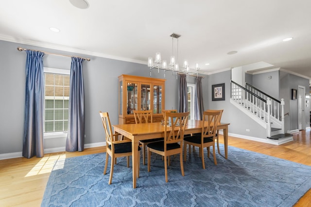 6972 W Imlay St, Chicago, IL 60631 - dining area featuring wood finished floors, crown molding, stairs, a chandelier, and recessed lighting