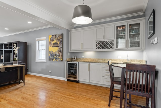 6972 W Imlay St, Chicago, IL 60631 - indoor wet bar featuring beverage cooler, light wood finished floors, crown molding, recessed lighting, and decorative light fixtures