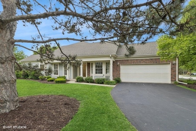 235 Spring Creek Cir Unit 0, Schaumburg, IL 60173 - view of front of house with asphalt driveway, a front yard, an attached garage, a shingled roof, and brick siding