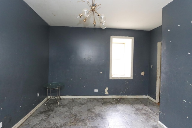 727 N Springfield Ave, Chicago, IL 60624 - spare room with baseboards and a chandelier