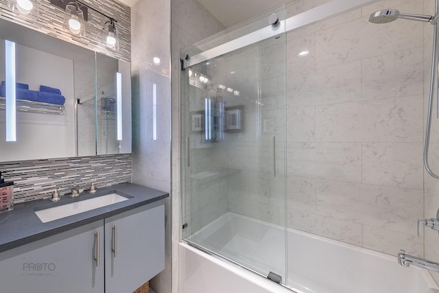 2400 N Lakeview Ave Unit 1706, Chicago, IL 60614 - bathroom featuring shower / bath combination with glass door, vanity, and tasteful backsplash