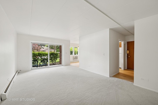 801 E Miner St Unit 1A, Arlington Heights, IL 60004 - carpeted spare room featuring baseboard heating and baseboards